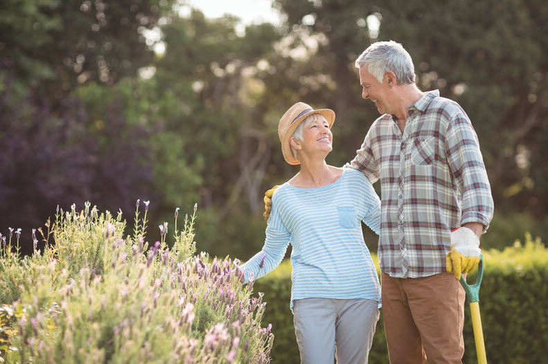 Couple standing in garden